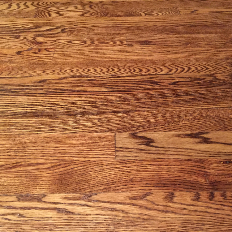 Oak hardwood floor beautifully finished in dark stain with satin polyurethane.